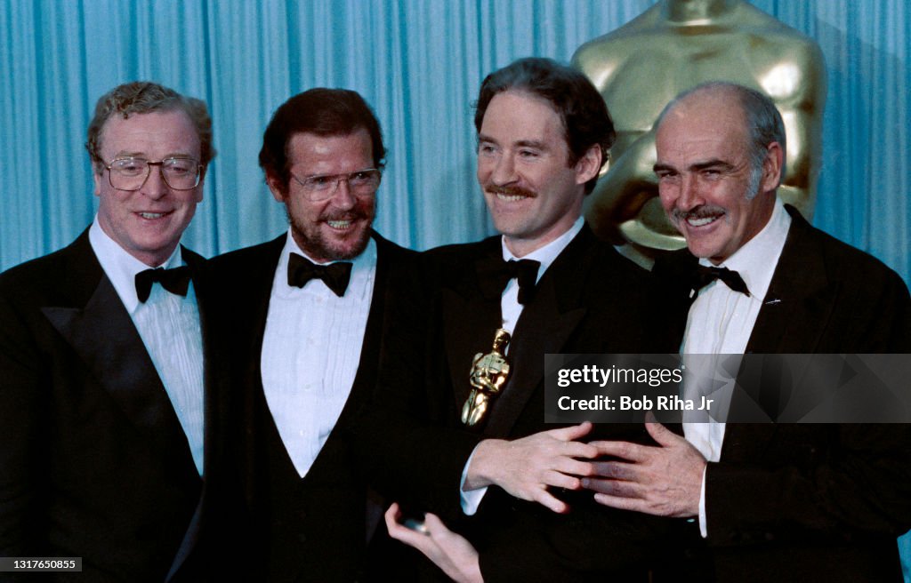 Michael Caine Roger Moore Kevin Kline Sean Connery at Academy Awards 1989