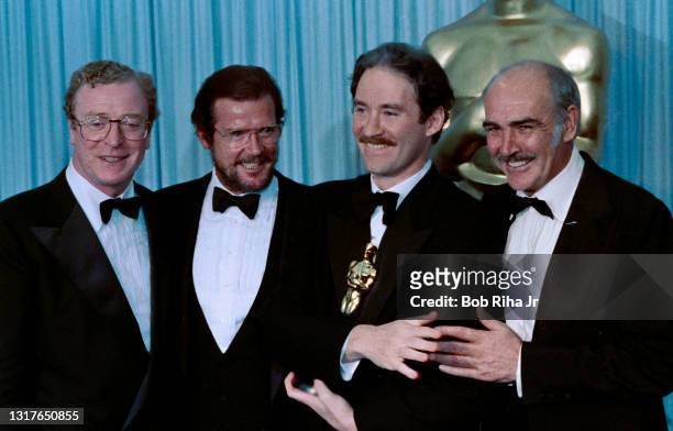 Michael Caine, Roger Moore, Oscar winner Kevin Kline and Sean Connery backstage at the 61st Annual Academy Awards Show at the Shrine Auditorium,...