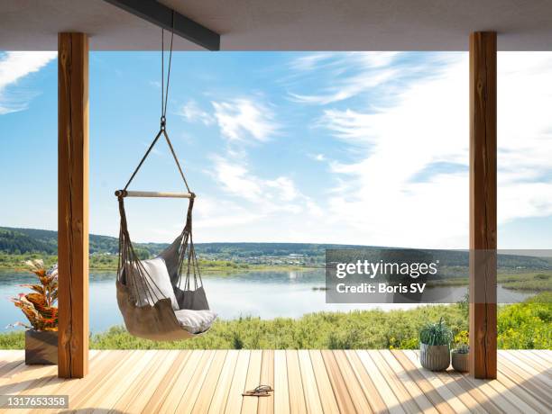 relaxing in hammock chair - bubble chair stock-fotos und bilder