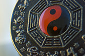 Extreme closeup macro photography of a Chinese Bagua object showing ying yang theory