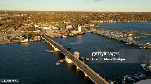 Establishing shot of Sturgeon Bay city in Door county, Wisconsin. Aerial view of American town. Sunny morning, sunrise. Spring summer season.