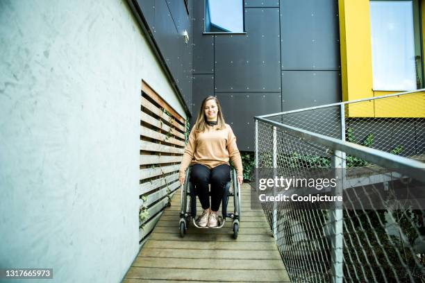 young disabled woman. - wheelchair ramp stock pictures, royalty-free photos & images