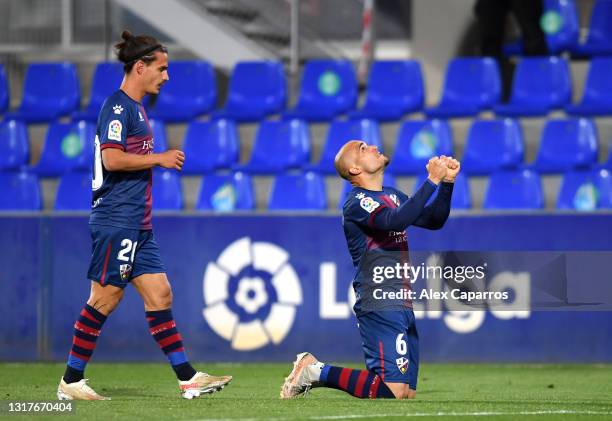 Sandro Ramirez of SD Huesca celebrates with Jaime Seoane after scoring their side's first goal during the La Liga Santander match between SD Huesca...