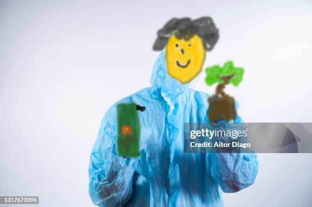 humour. scientist with a drawn face has instead of a hand a painted tree. - occupational safety and health stock-fotos und bilder