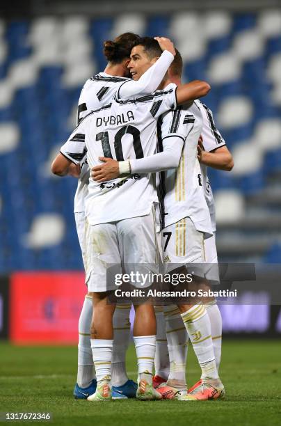 Cristiano Ronaldo of Juventus celebrates with Paulo Dybala after scoring their side's second goal during the Serie A match between US Sassuolo and...