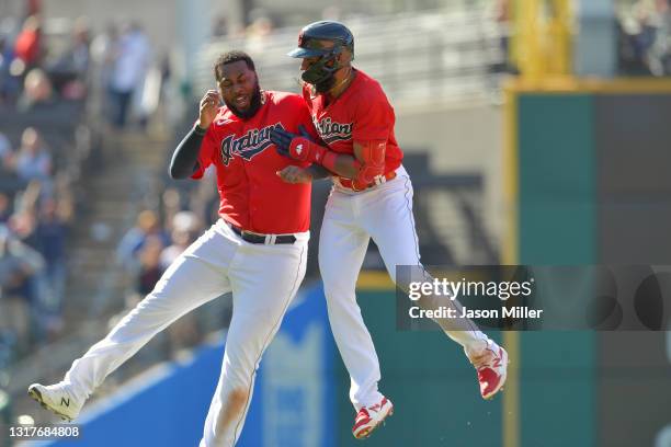 Franmil Reyes celebrates with Amed Rosario of the Cleveland Indians after Rosario hit a walk-off RBI single to defeat the Chicago Cubs at Progressive...