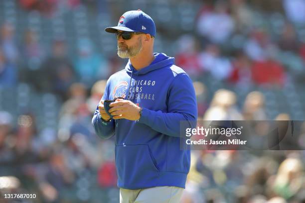Manager David Ross returns to the dugout after a pitching change during the sixth inning against the Cleveland Indians at Progressive Field on May...