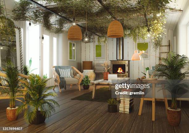 green cozy living room with lots of houseplants - cozy home interior stock pictures, royalty-free photos & images