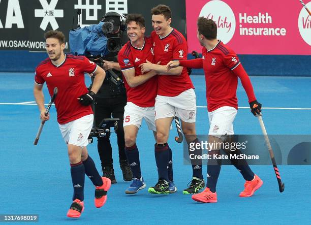 Harry Martin of Great Britain celebrates scoring their team's fifth goal whilst embracing team mate Phil Roper during the FIH Hockey Pro League match...