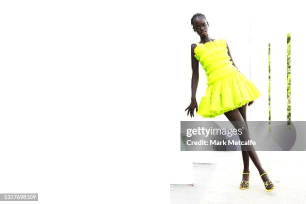 Model Koujayn poses backstage ahead of the Aje Resort 22 Runway show at The Calyx, Royal Botanic Garden on May 11, 2021 in Sydney, Australia.