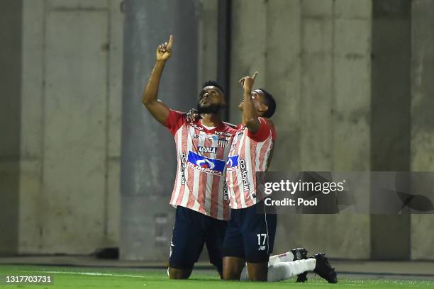 Miguel Borja of Junior celebrates with teammate Gabriel Fuentes after scoring the first goal of his team during a match between Junior and River...