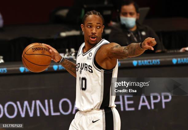 DeMar DeRozan of the San Antonio Spurs leads the offense in the second quarter against the Brooklyn Nets at Barclays Center on May 12, 2021 in the...