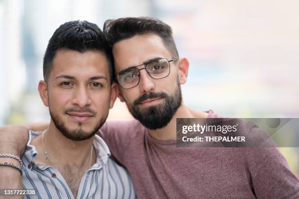 young lgtb couple in the city - latino gay stock pictures, royalty-free photos & images