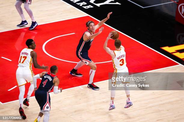 Kevin Huerter of the Atlanta Hawks takes a shot as Robin Lopez of the Washington Wizards defends during a game between the Washington Wizards and the...
