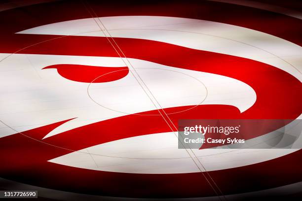 The Atlanta Hawks logo is seen on the court before the start of a game between the Washington Wizards and the Atlanta Hawks at State Farm Arena on...