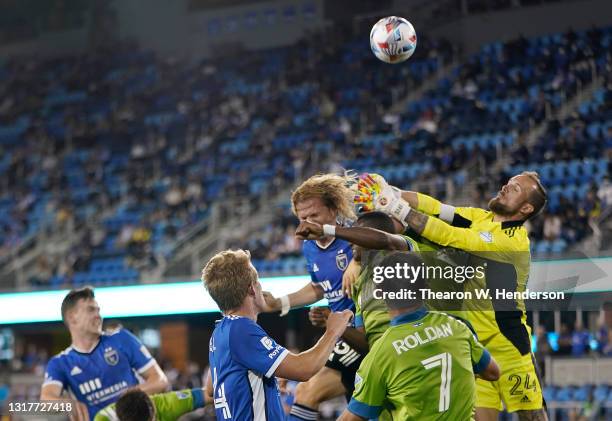 Goalkeeper Stefan Frei of Seattle Sounders leaps in the air to slap the ball away from his goal against the San Jose Earthquakes during the second...