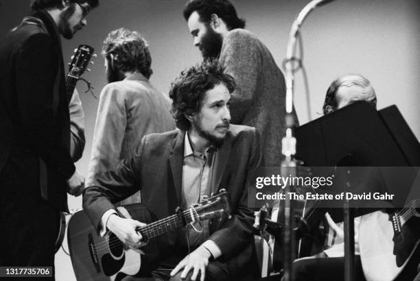 Singer songwriter Bob Dylan performs at the Woody Guthrie Memorial Concert on January 20, 1968 at Carnegie Hall in New York City, New York. Behind...