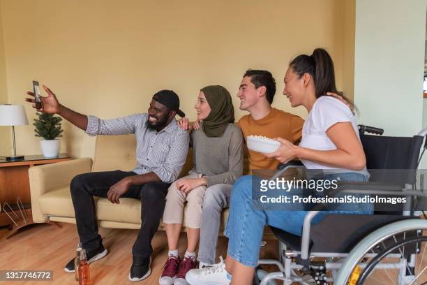 happy group of young multicultural friends is spending wonderful time together and taking self portrait photography. - disability collection stock pictures, royalty-free photos & images