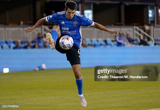 Shea Salinas of San Jose Earthquakes leaps in the air to gain control of the ball against the Seattle Sounders during the second half at PayPal Park...