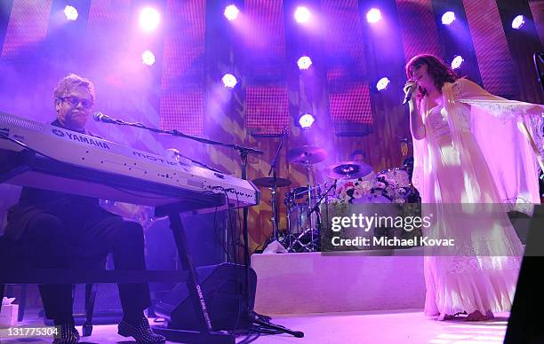 Musician Sir Elton John and Singer Florence Welch of the musical group Florence and The Machine perform onstage at the 19th Annual Elton John AIDS...