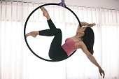 Female aerial dancer on the hoop.