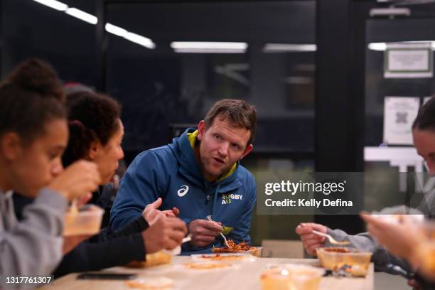 Peter Breen of the Melbourne Rebels Super W team speaks to players during a post training meal during the Melbourne Rebels Super W training session...