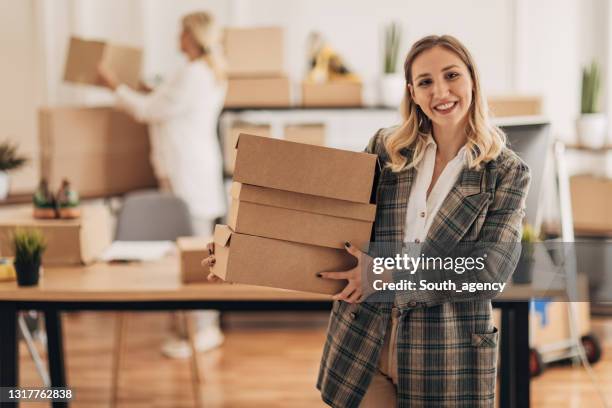 woman carrying orders for shipping - shoe box stock pictures, royalty-free photos & images