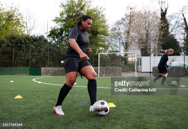 women's football team train for football game - soccer dribbling stock pictures, royalty-free photos & images