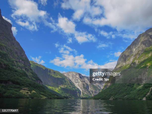 view over the nærøyfjord in norway during a beautiful summer day - aurlandsfjord stock pictures, royalty-free photos & images