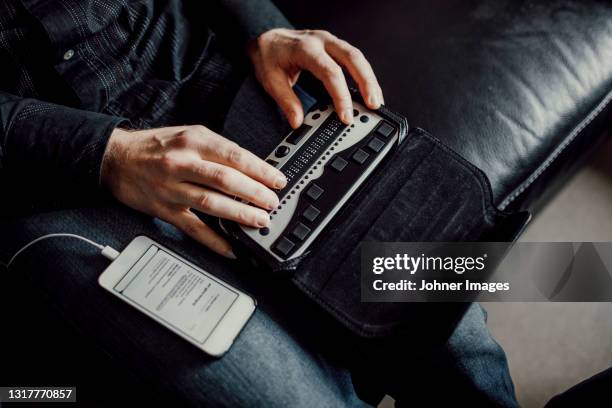 man using braille keyboard - blind man stock pictures, royalty-free photos & images