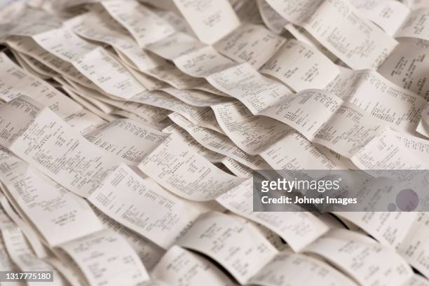high angle view of various receipts - recibo fotografías e imágenes de stock