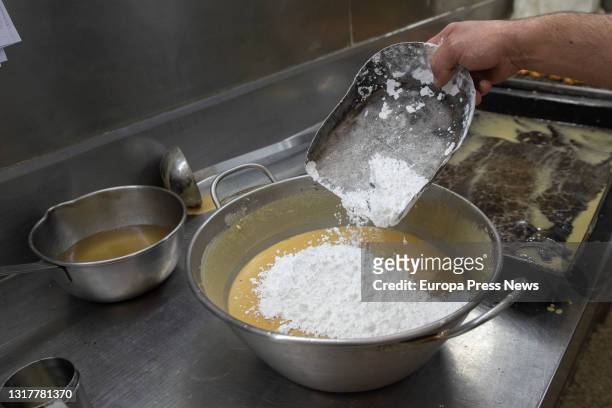 The pastry chef makes the dough for the typical San Isidro doughnuts at Casa Mira, on May 13, 2021 in Madrid, Spain. The different types of donuts...