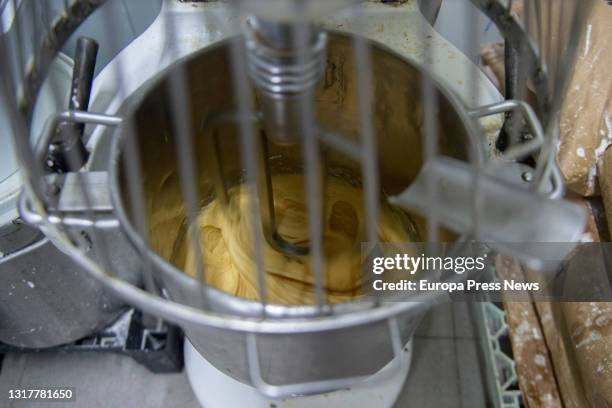 Elaboration of the dough of the typical donuts of San Isidro just out of the oven, in Casa Mira, on May 13, 2021 in Madrid, Spain. The different...