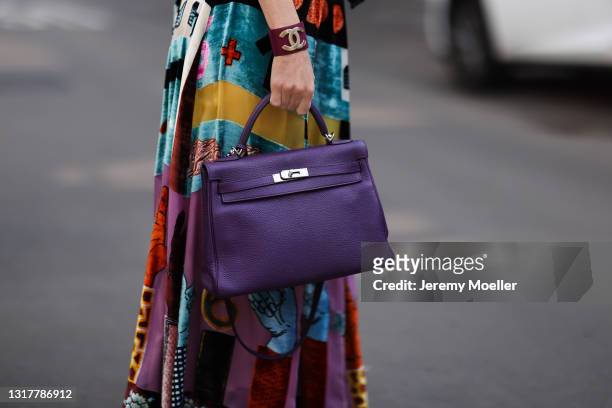 Alexandra Lapp wearing colorful Valentino dress and purple Hermès