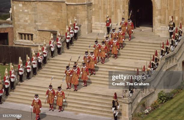 High angle view of the Yeomen of the Guard flanked by Royal Guards during the Garter Day ceremony on the steps of St George's Chapel, Windsor Castle...