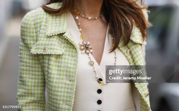 Alexandra Lapp wearing beige Dior vest, green Chanel tweed jacket and jewellery, all via SuperBrands secondhand store, on May 03, 2021 in Dusseldorf,...