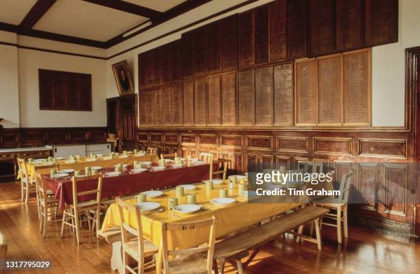 Interior view of the refectory, with tables prepared for pupils, at Ludgrove School, an independent preparatory boarding school in Wokingham,...