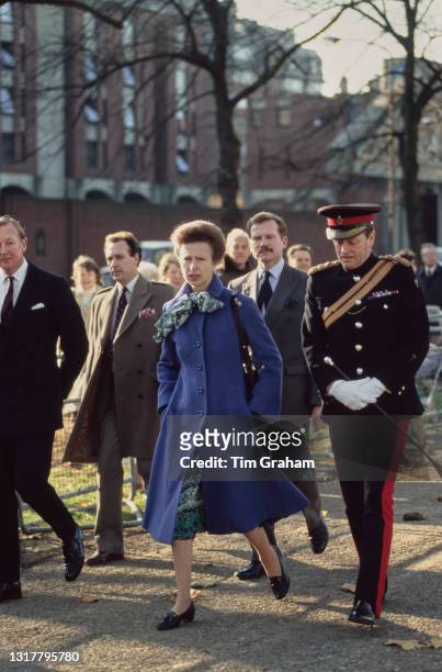 British Royal Anne, Princess Royal, wearing a blue coat, and Brigadier Andrew Parker-Bowles, in ceremonial uniform, attend an unspecified event in...