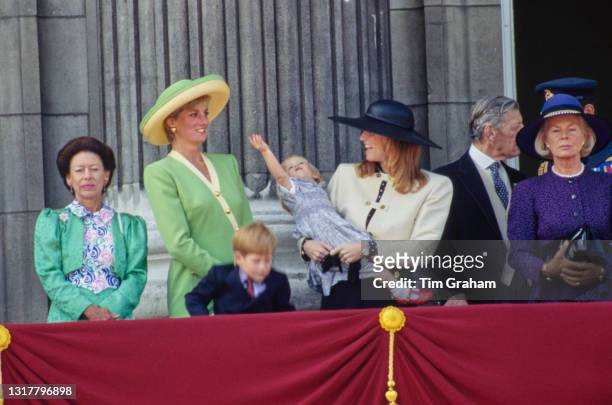 British royals Princess Margaret, Countess of Snowdon , Diana, Princess of Wales , wearing a green and yellow outfit with matching hat, with Prince...
