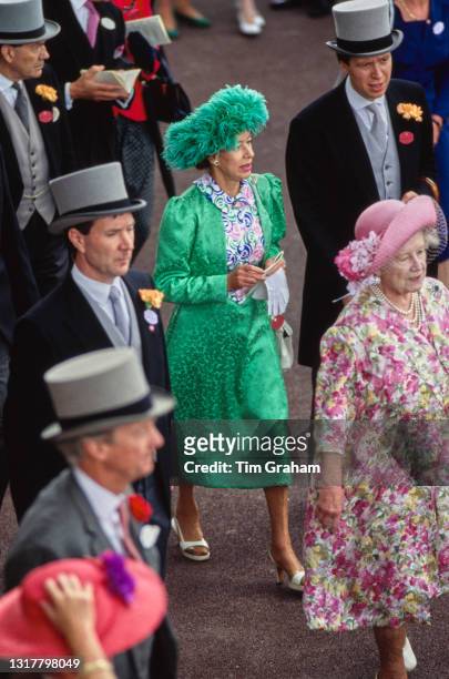 British Royals Princess Margaret, Countess of Snowdon , wearing a green outfit with a matching green hat, and Queen Elizabeth The Queen Mother , in a...