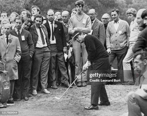 Spectators look on as Lee Trevino of the United States plays a chip shot to the 3rd green during the Piccadilly World Match Play Championship golf...