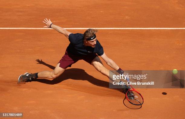Denis Shapovalov of Canada stretches for a backhand in their mens singles third round match against Rafael Nadal of Spain during Day Six of the...