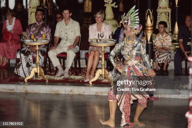 British Royals Charles, Prince of Wales, wearing a safari suit, and Diana, Princess of Wales , wearing a pink and white floral patterned Catherine...