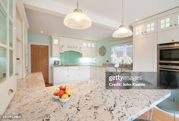 property interiors - quartz kitchen stock pictures, royalty-free photos & images