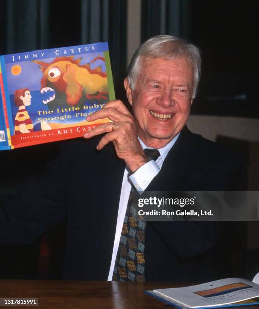 Jimmy Carter attends "The Little Baby Snoogle-Fleejer" Book Party at Barnes and Noble in New York City on December 13, 1995.