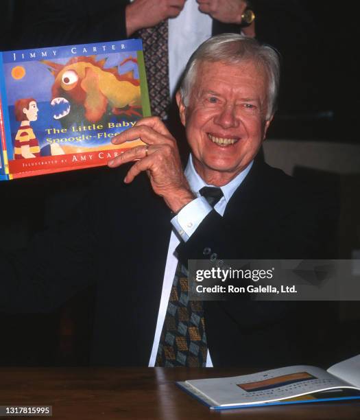 Jimmy Carter attends "The Little Baby Snoogle-Fleejer" Book Party at Barnes and Noble in New York City on December 13, 1995.