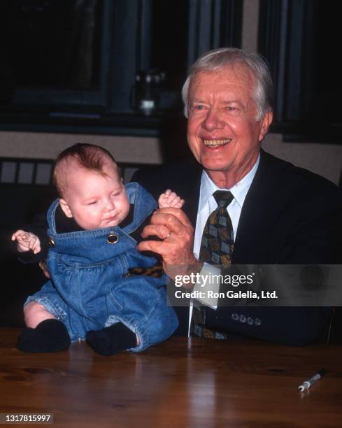 Jimmy Carter attends "The Little Baby Snoogle-Fleejer" Book Party at Barnes and Noble in New York City on December 13, 1995.