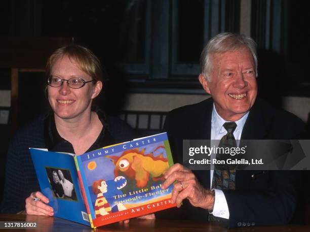 Amy Carter and Jimmy Carter attend "The Little Baby Snoogle-Fleejer" Book Party at Barnes and Noble in New York City on December 13, 1995.