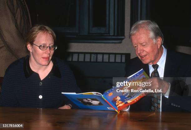 Amy Carter and Jimmy Carter attend "The Little Baby Snoogle-Fleejer" Book Party at Barnes and Noble in New York City on December 13, 1995.