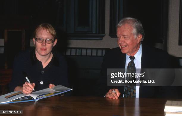 Amy Carter and Jimmy Carter attend "The Little Baby Snoogle-Fleejer" Book Party at Barnes and Noble in New York City on December 13, 1995.